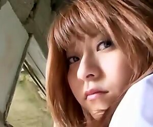Kinky Japanese student Mika Orihara pulls up skirt and shows her butt