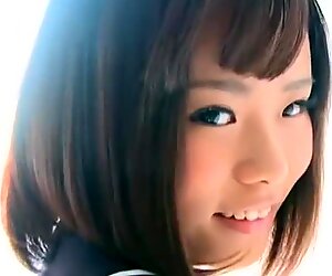 Hitomi strips slowly out of her school uniform to show her panties