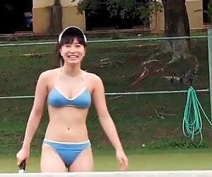 Japanese beauty plays bikini on tennis court